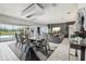Well-lit dining space leading to the living room with outdoor views. Perfect for entertaining guests and hosting dinners at 13136 Alderley Drive Dr, Orlando, FL 32832