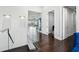 Bright hallway features hard wood floors, textured walls, and a glass railing overlooking the home's main living space at 13136 Alderley Drive Dr, Orlando, FL 32832