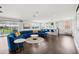 Living room with bar area and seating, with a large sofa for watching movies on a projector at 13136 Alderley Drive Dr, Orlando, FL 32832
