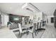 Open-concept space with modern lighting, large dining table, and seamless flow into the gourmet kitchen and living spaces at 13136 Alderley Drive Dr, Orlando, FL 32832
