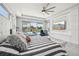 Spacious main bedroom with large windows, pool view, and a modern entertainment center at 13136 Alderley Drive Dr, Orlando, FL 32832