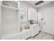 Mudroom features custom storage with built-in bench seating, cabinets, coat rack and stylish decor at 13136 Alderley Drive Dr, Orlando, FL 32832