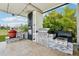 Outdoor kitchen includes stainless steel grill, pizza oven, and bar area at 13136 Alderley Drive Dr, Orlando, FL 32832