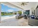 Spacious outdoor living area featuring a pool, spa, and covered seating at 13136 Alderley Drive Dr, Orlando, FL 32832