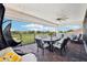 Spacious covered patio with outdoor seating and scenic views of the golf course at 13136 Alderley Drive Dr, Orlando, FL 32832