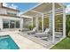 Relaxing pool area with pergola, chaise lounges, and swing at 13136 Alderley Drive Dr, Orlando, FL 32832