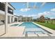 Beautiful backyard featuring a pool, spa, pergola, outdoor seating, and a playground at 13136 Alderley Drive Dr, Orlando, FL 32832