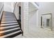 Striking staircase with black and white steps, leading to an upper level with textured wall design at 13136 Alderley Drive Dr, Orlando, FL 32832