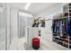 Walk-in closet with ample storage space, custom shelving, and a center island at 13136 Alderley Drive Dr, Orlando, FL 32832