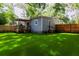 Rear exterior of home with small porch area and a fenced yard at 1407 Noble Pl, Orlando, FL 32801