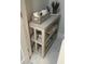Bathroom features an open shelving unit, clean towels, and marble tile flooring at 1407 Noble Pl, Orlando, FL 32801