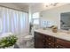 Bright bathroom features a double sink vanity, shower/tub combination, and neutral finishes at 1407 Noble Pl, Orlando, FL 32801