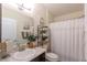 Traditional bathroom with vanity and shower/tub with white shower curtain at 1407 Noble Pl, Orlando, FL 32801