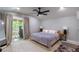 Relaxing bedroom with a ceiling fan and access to an outdoor deck at 1407 Noble Pl, Orlando, FL 32801