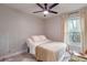 Cozy bedroom with natural light, plush carpet, and neutral decor at 1407 Noble Pl, Orlando, FL 32801