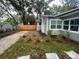 Charming house exterior with stone walkway, driveway and manicured landscaping at 1407 Noble Pl, Orlando, FL 32801