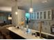 Modern kitchen featuring white cabinets, an island with seating, and stainless steel appliances at 1407 Noble Pl, Orlando, FL 32801