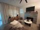 Stylish living room boasts a fireplace, plush seating, and modern decor at 1407 Noble Pl, Orlando, FL 32801