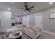 Spacious living room featuring ample lighting, cozy decor, and modern finishes at 1407 Noble Pl, Orlando, FL 32801