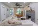 Well-lit living room with fireplace, plush seating, and modern décor at 1407 Noble Pl, Orlando, FL 32801