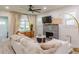 Comfortable living room with fireplace, decorative furnishings, and open feel at 1407 Noble Pl, Orlando, FL 32801