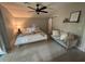 Serene main bedroom features a sitting area, soft rug, and neutral tones at 1407 Noble Pl, Orlando, FL 32801