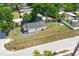 An aerial shot displays a home with a fenced yard, complemented by street access at 1521 Nieuport Ln, Orlando, FL 32805