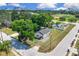 Charming home featuring a well-manicured lawn, mature trees, and a corner lot in an urban neighborhood at 1521 Nieuport Ln, Orlando, FL 32805