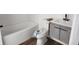 Modern renovated bathroom boasts new fixtures, tub, and stylish vanity at 1521 Nieuport Ln, Orlando, FL 32805