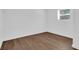 Well-lit bedroom featuring pristine white walls and stylish wood-look flooring, enhancing the space at 1521 Nieuport Ln, Orlando, FL 32805