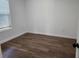 Bright bedroom with updated flooring and fresh paint, awaiting your personal touch at 1521 Nieuport Ln, Orlando, FL 32805