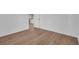 Bright bedroom featuring neutral walls and modern wood-look flooring, creating an open and inviting space at 1521 Nieuport Ln, Orlando, FL 32805