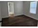 Clean bedroom featuring hardwood flooring, neutral paint, and natural light at 1521 Nieuport Ln, Orlando, FL 32805