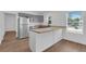 A modern kitchen featuring gray cabinets, butcher block countertops, and stainless steel appliances at 1521 Nieuport Ln, Orlando, FL 32805