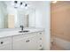 Updated bathroom features a vanity with a decorative sink and a tiled shower/tub combo at 204 Celebration Blvd, Celebration, FL 34747
