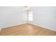 Empty, bright bedroom with ceiling fan, wood floors, and two windows at 204 Celebration Blvd, Celebration, FL 34747