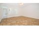 Sunroom-style bedroom is bright and airy with a ceiling fan and a glass door leading to the outside at 204 Celebration Blvd, Celebration, FL 34747