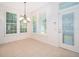 Bright breakfast nook with shuttered windows and a door to the exterior at 204 Celebration Blvd, Celebration, FL 34747