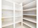 This closet boasts ample storage space with adjustable white shelving and great lighting at 204 Celebration Blvd, Celebration, FL 34747