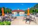 Beautiful community pool with lounge chairs and tables, perfect for relaxing and enjoying the outdoors at 204 Celebration Blvd, Celebration, FL 34747