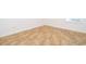 A close up view shows the neutral, multi-shade vinyl flooring at 204 Celebration Blvd, Celebration, FL 34747