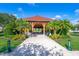 Beautiful gazebo in a community park with picnic tables, perfect for outdoor gatherings and relaxation at 204 Celebration Blvd, Celebration, FL 34747