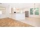 Open kitchen with stainless steel appliances, an island, and views to living space at 204 Celebration Blvd, Celebration, FL 34747