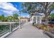 Lakeside boardwalk view with benches and lush greenery, offering a tranquil and picturesque setting at 204 Celebration Blvd, Celebration, FL 34747