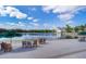 Lakefront view with outdoor seating, inviting residents to enjoy serene water views at 204 Celebration Blvd, Celebration, FL 34747