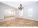Bright and airy living room with a chandelier, neutral walls, and an open floor plan at 204 Celebration Blvd, Celebration, FL 34747
