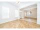 A bright living room with windows, neutral walls, and an open doorway at 204 Celebration Blvd, Celebration, FL 34747