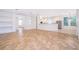 Open floor plan featuring archways and built-in shelving connecting the living room and kitchen at 204 Celebration Blvd, Celebration, FL 34747