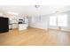 Spacious living room open to the kitchen, featuring light wood floors and large windows at 204 Celebration Blvd, Celebration, FL 34747