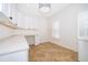 Bright office features custom built-ins, plenty of counter space, and natural light from multiple windows at 204 Celebration Blvd, Celebration, FL 34747